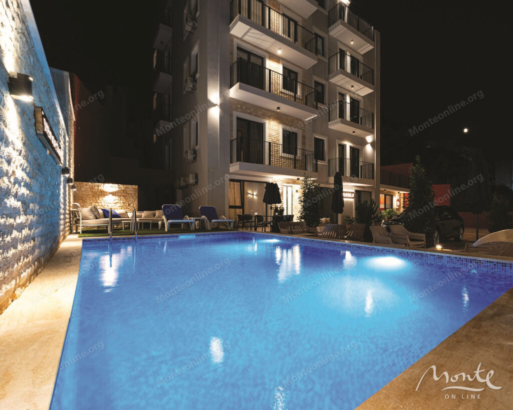 Two-bedroom apartment in a modern residential complex with a swimming pool in Budva 01