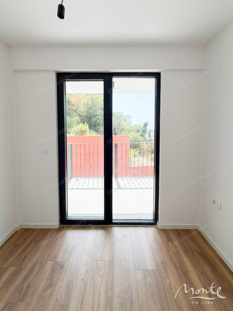 Two-bedroom apartment in a modern residential complex with a swimming pool in Budva 07