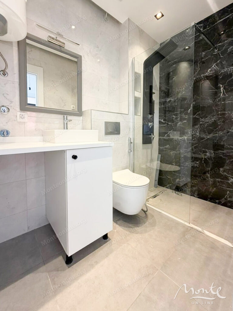 Two-bedroom apartment in a modern residential complex with a swimming pool in Budva 09