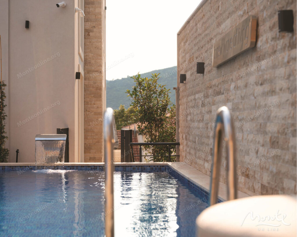 Two-bedroom apartment in a modern residential complex with a swimming pool in Budva 11