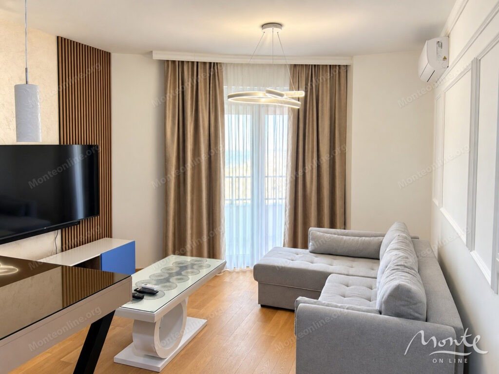 New apartment with 1 bedroom, terrace and garage space in Becici 01
